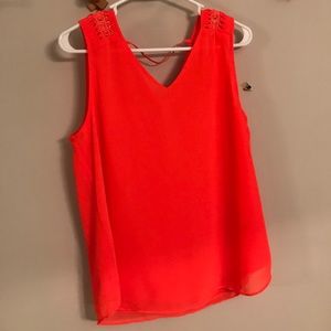 Bright orange-y top